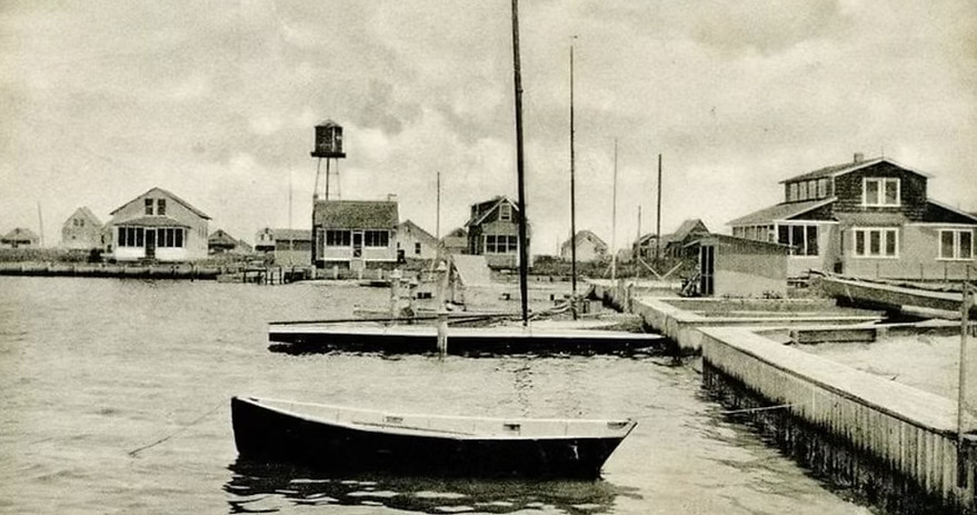 Archival photograph of early Harvey Cedars: beachfront cottages and residents along the Long Beach Island shore